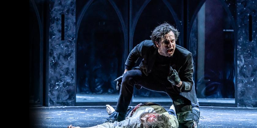 Richard III stands over a man on the floor looking angry