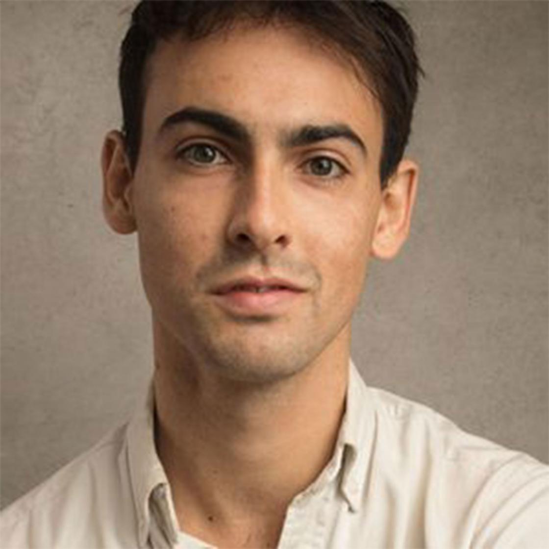 Dan Armstrong is a white male, with short dark brown hair. He wears a white shirt.