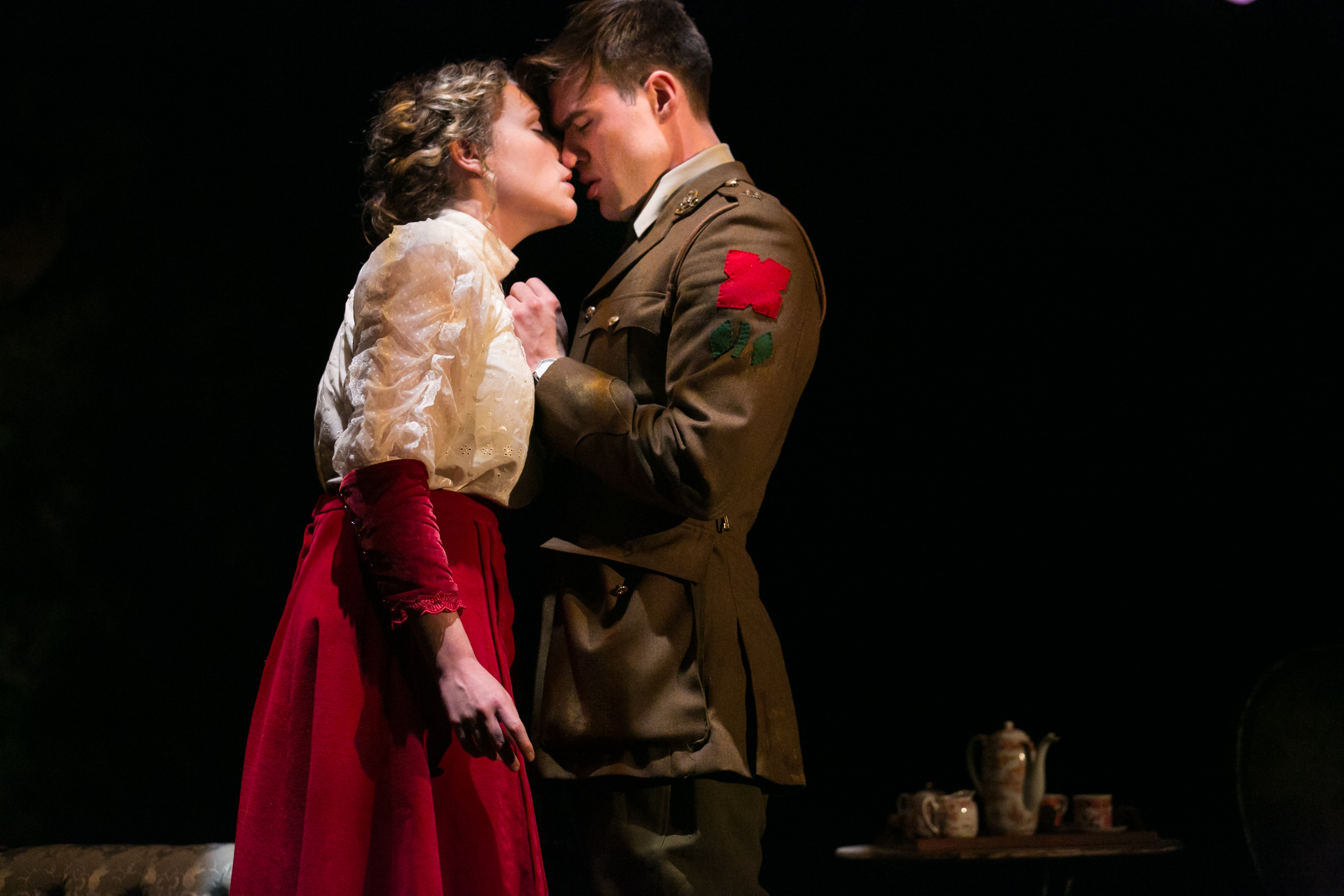 A soldier kisses a woman