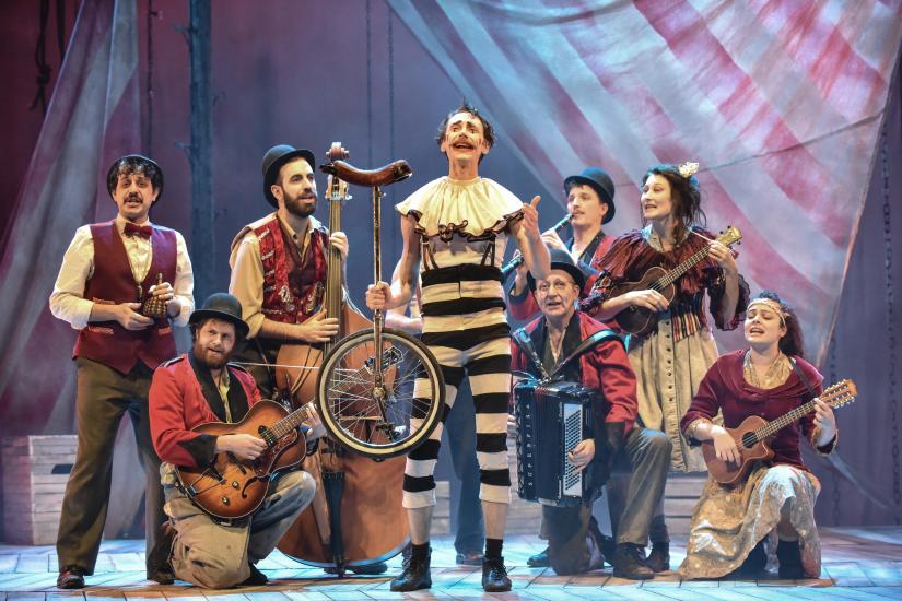 Group circus shot with clowns and performers