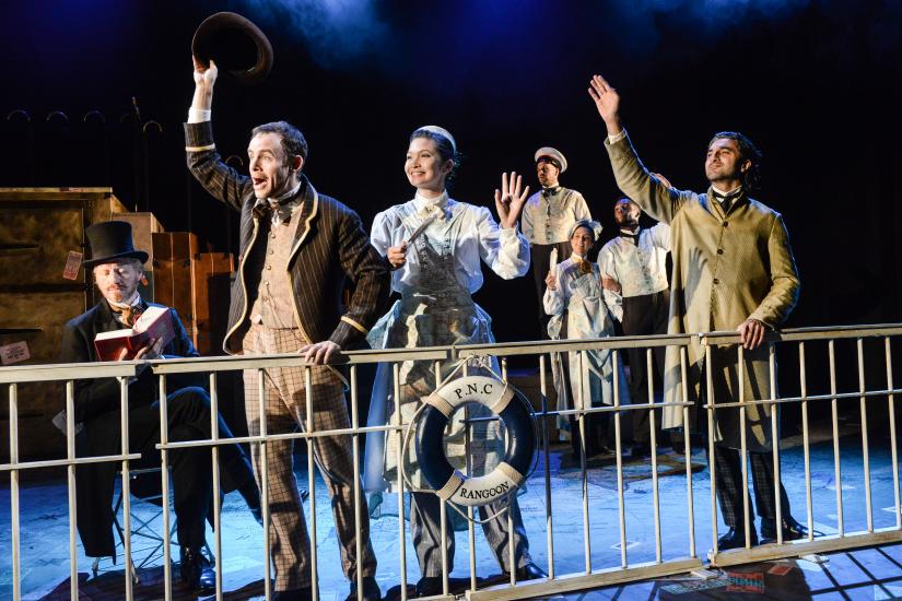 Characters wave from aboard a boat deck