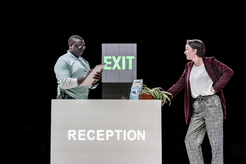 Woman inquiring at a reception desk