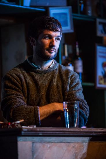 A barman crossing his arms