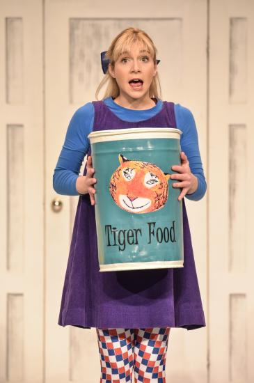 Sophie carries a very large tin of Tiger food