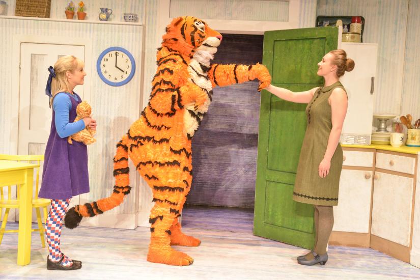The Tiger shakes Sophie's mum's hand as they stand in the kitchen