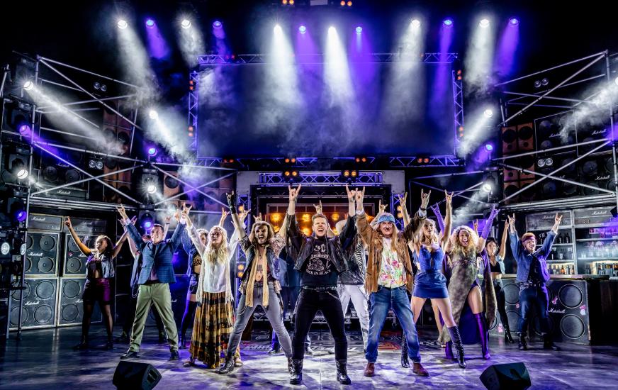 The cast of Rock of Ages on stage