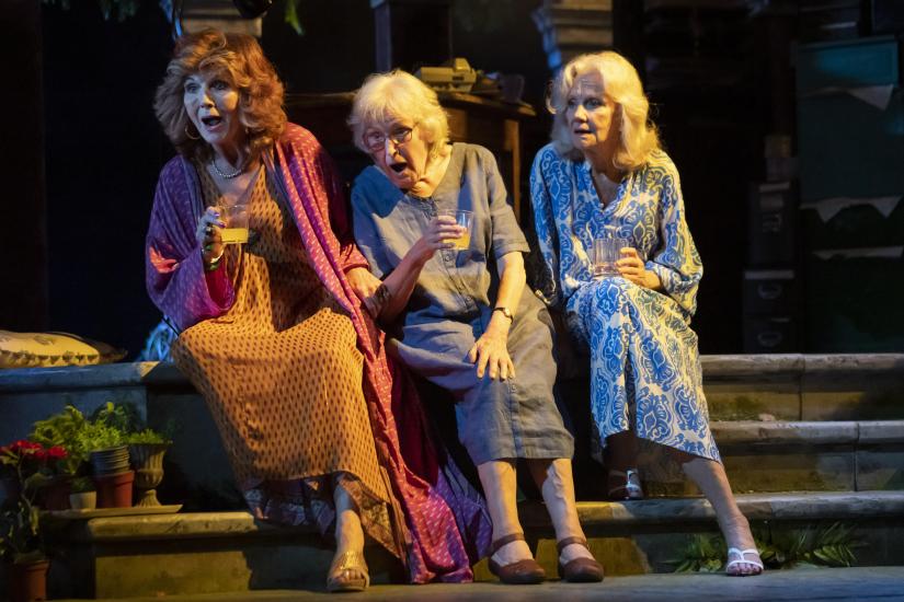 Three women sit together