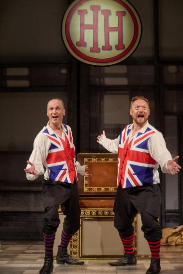 Two men wearing union jack waistcoats entertain the audience