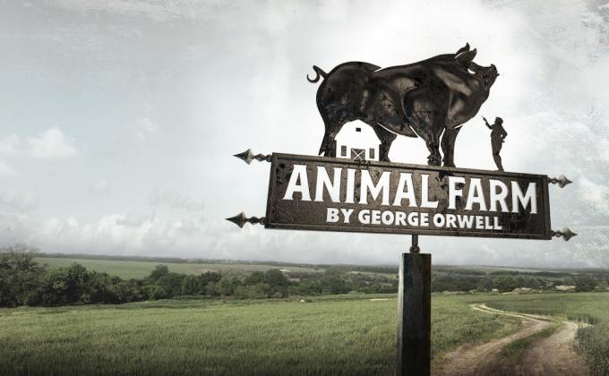 A farm sign with a pig on it