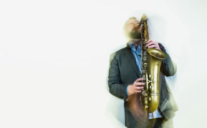 A man plays a saxophone