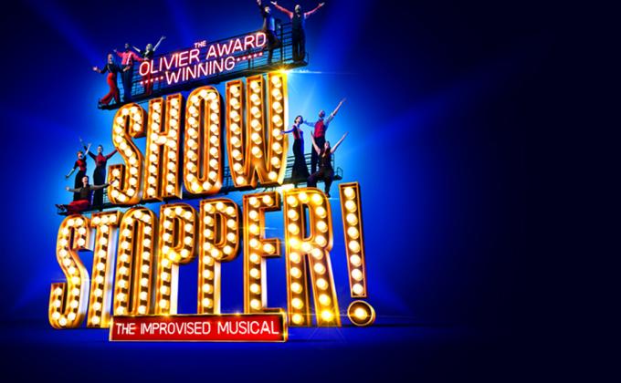 Big gold light-up letters spelling Showstopper!