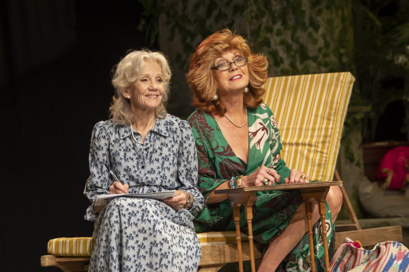 Hayley Mills and Rula Lenska sit on a deck chair, smiling. 