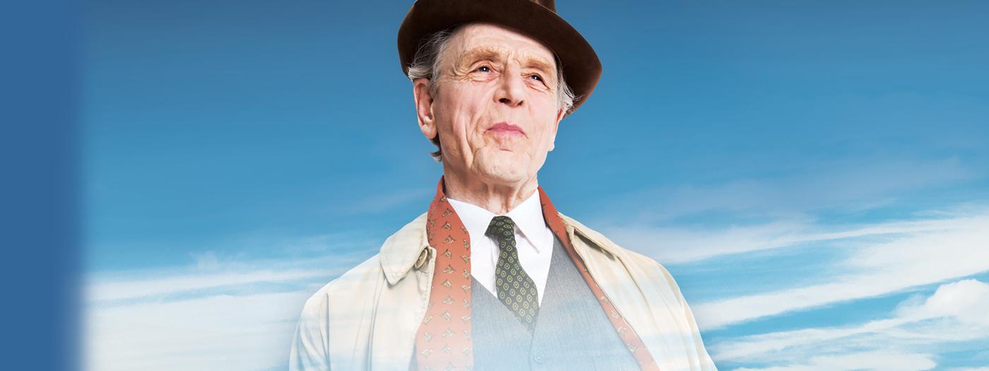 Edward Fox in coat, scarf and hat