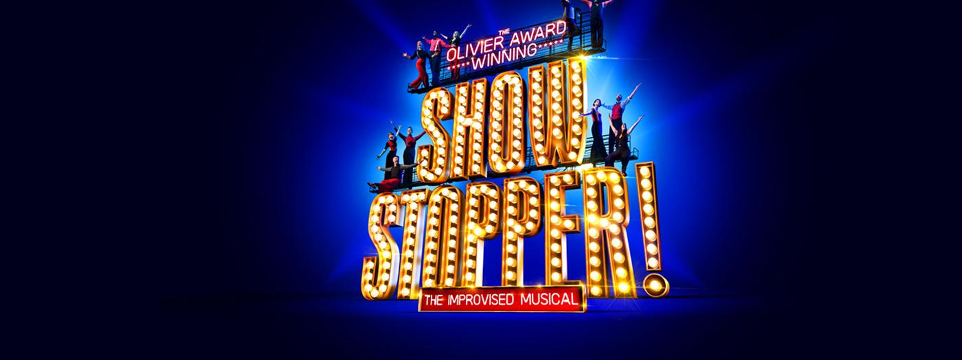 Big gold light-up letters spelling Showstopper!