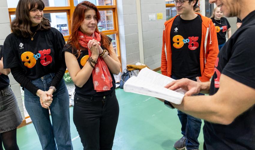A group of actors rehearsing